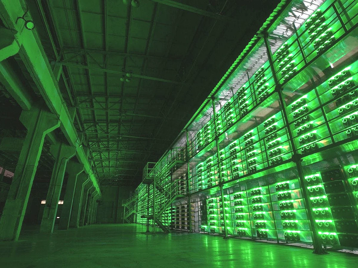 Large green-lit mining facility reference image for AC12